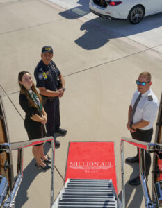 million air dallas attendants waiting at the bottom of jet stairs